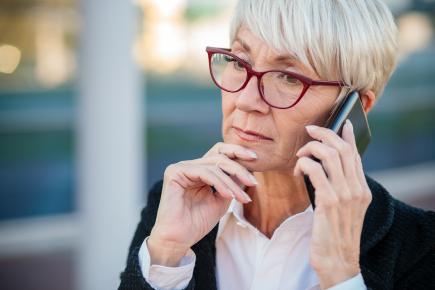 older woman on mobile phone